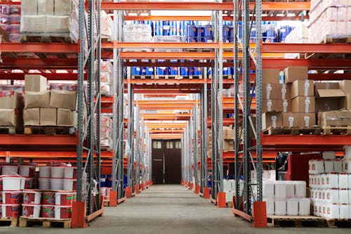 Organized wholesale distribution warehouse with stocked shelves